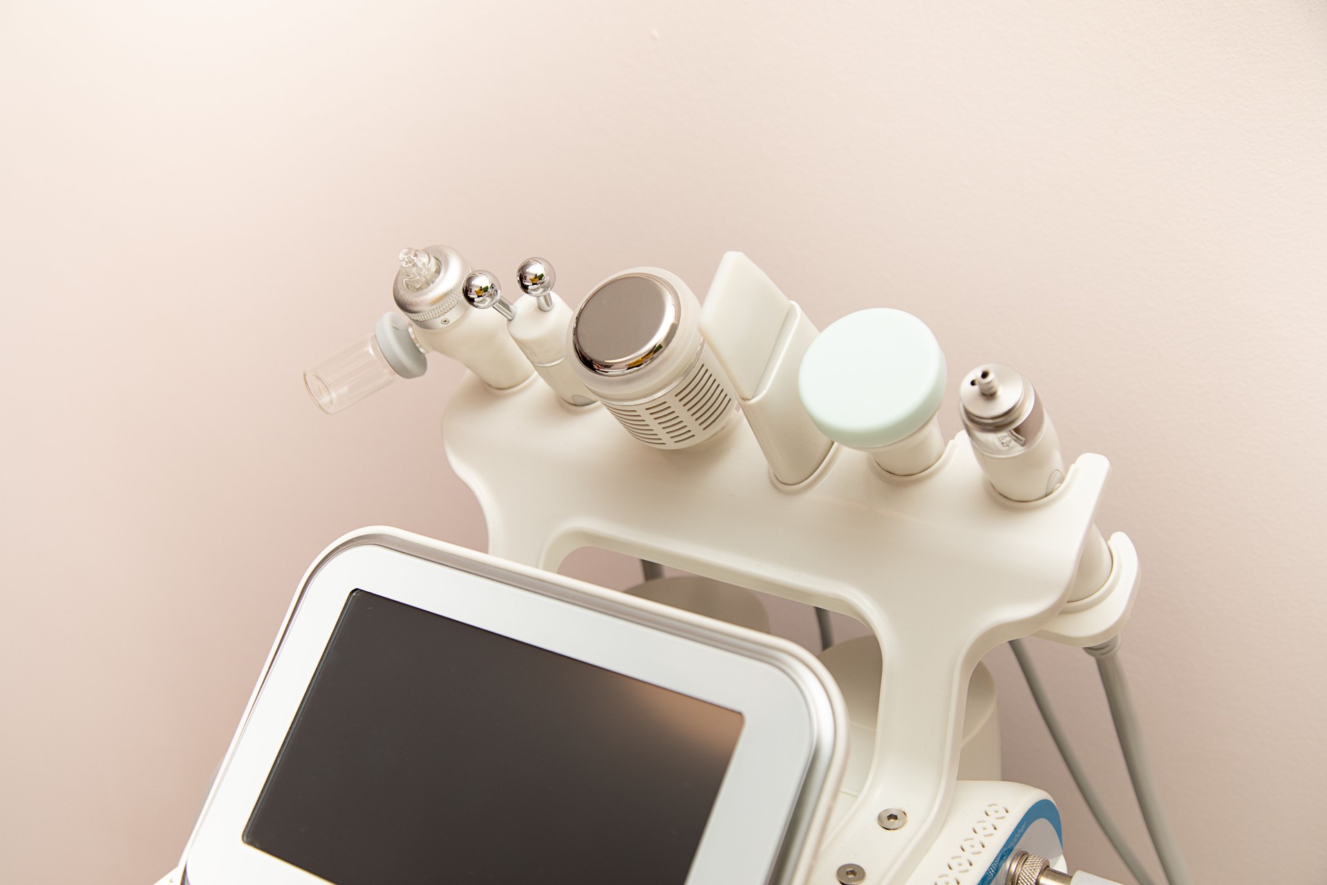 Attachments to device Hydradermabrasian facial skin care machine in spa clinic for anti-aging or acne treatment. concept of aesthetic medicine, self-care, latest technologies in beauty industry